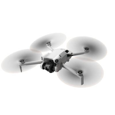 A white quadcopter drone with four rotors and a camera on the front. Top-down view against a white background.