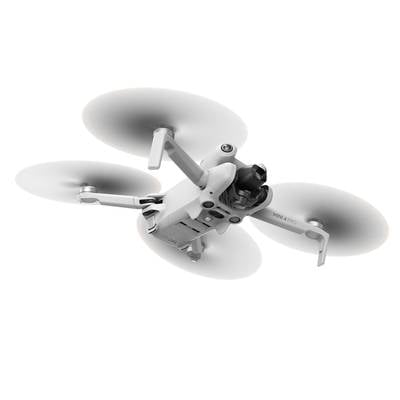 A white-grey drone with three rotors is flying in the air. It is compact and displays technological details.