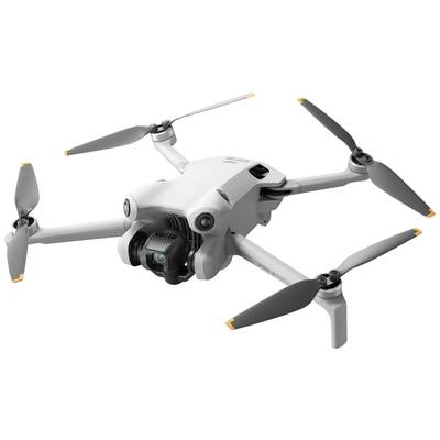 White drone with four rotors in the air, equipped with a camera on the front.