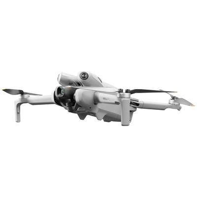 A grey drone with four propellers, elegant and compact in design, flies against a light background.