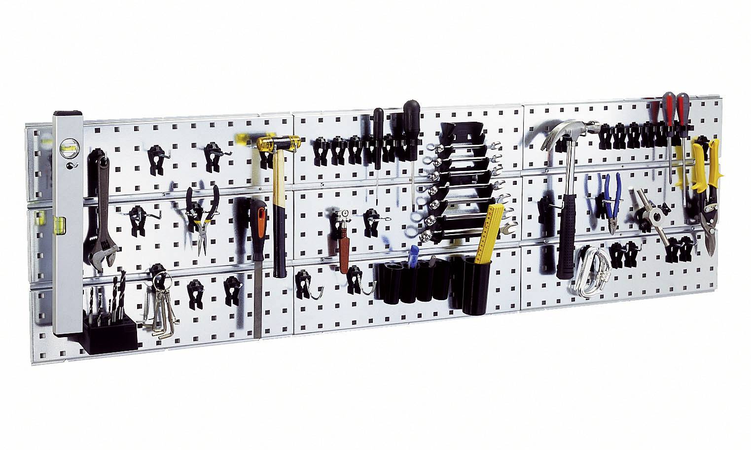 Tool wall with various hand tools such as hammers, spanners, screwdrivers and pliers, neatly hung up.