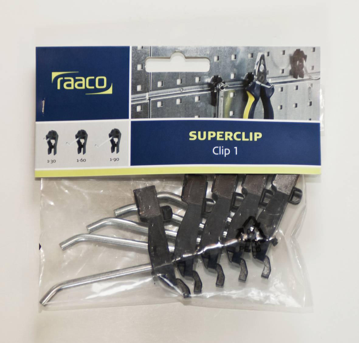 A pack of 'Superclip Clip 1' from raaco, shows six metal clips. Examples of use are illustrated on a perforated board above.