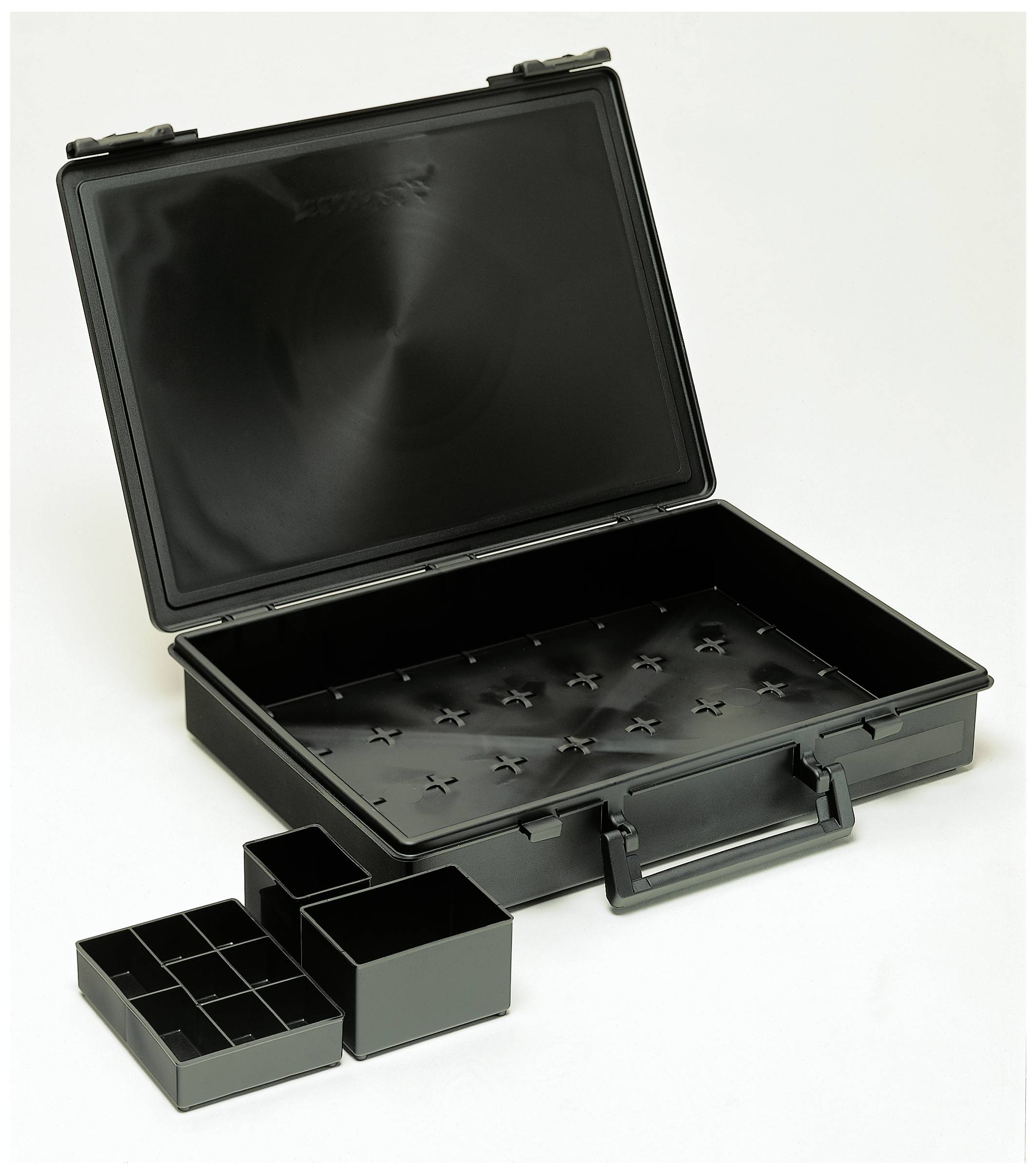 Black plastic case with open lid, empty interior and three removable compartments of varying sizes lying beside it.