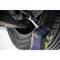 A person is repairing a car by working on a wheel with a spanner. The focus is on the tool and the tyre.