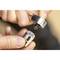 Two hands are holding a ratchet and a socket, ready to join together. Close-up view, focusing on tool compatibility.