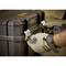 A person wearing work gloves is closing a black, robust plastic toolbox with metal latches.