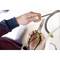 'Hands are holding pliers to cut wires. One person is using a tool with a yellow handle for precise electrical installation work.'