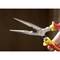 A hand holds a pair of pliers with yellow and red handles and a long, pointed tip; suitable for precise gripping or cutting.
