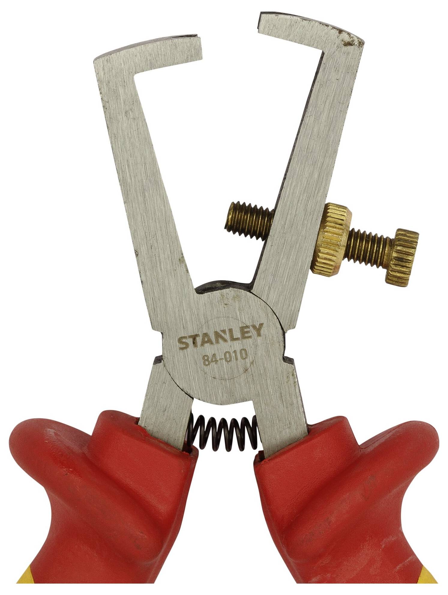 Wire stripping pliers with red handles and an adjustable screw, Stanley brand.