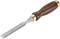 A chisel with a wooden handle, metal blade, and gold-coloured elements. The tool is suitable for woodworking.