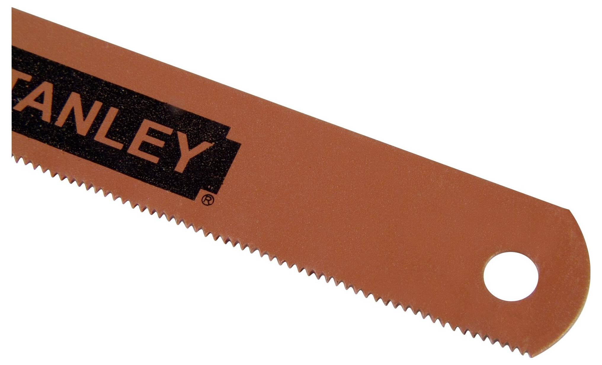 Close-up of a metal saw with serrated edge and hanging hole.