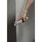 An arm holds a tool being used at the edge of a grey plate. It appears to be an edge processing tool.