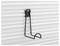 A black metal bracket is attached to a ridged white wall, suitable for hanging items such as a hose or cables.