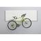 Green racing bicycle hangs on a grey-white wall mount. The frame and wheels emphasise the slender design against the minimalist background.