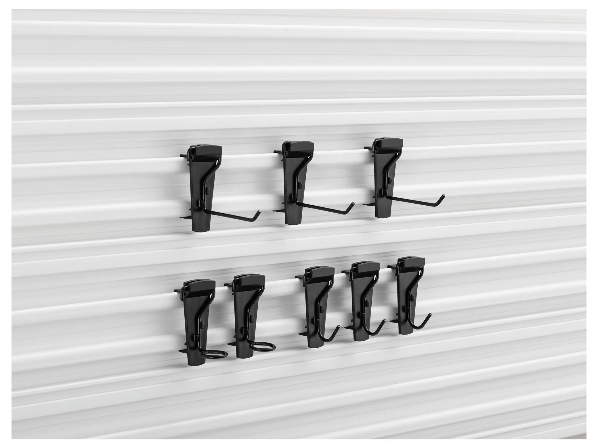 Six black bicycle wall mounts are mounted on vertical metal panels. They are arranged in two rows.