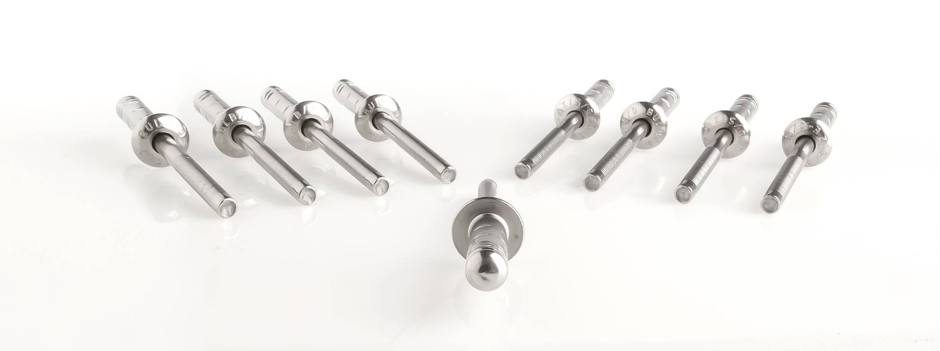 Eight silver bolts arranged in a circle, with one lying horizontally in the centre.