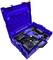 A blue electric power tool case with a cordless drill, two batteries, and a charger. The case has a honeycomb-patterned interior.