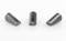 Three cylindrical metal pieces on a surface, arranged symmetrically.
