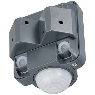 Grey motion sensor with two sensors and a semi-circular cover grille on the front. Mounted on a flat surface.