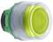 A round, green-yellow push button with a transparent plastic rim.