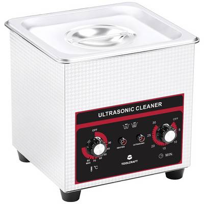 Ultrasonic cleaner with temperature and time control settings, marked with 'Ultrasonic Cleaner' on the front panel.