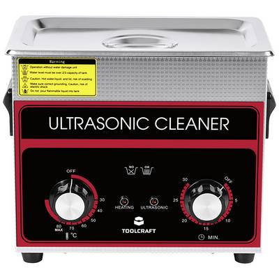 An ultrasonic cleaner with two rotary knobs for temperature setting (left, 0-80°C) and time setting (right, 0-15 minutes), warning notices at the top.