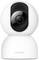 A white, round indoor surveillance camera with a lens in the centre, featuring a pivoting head.