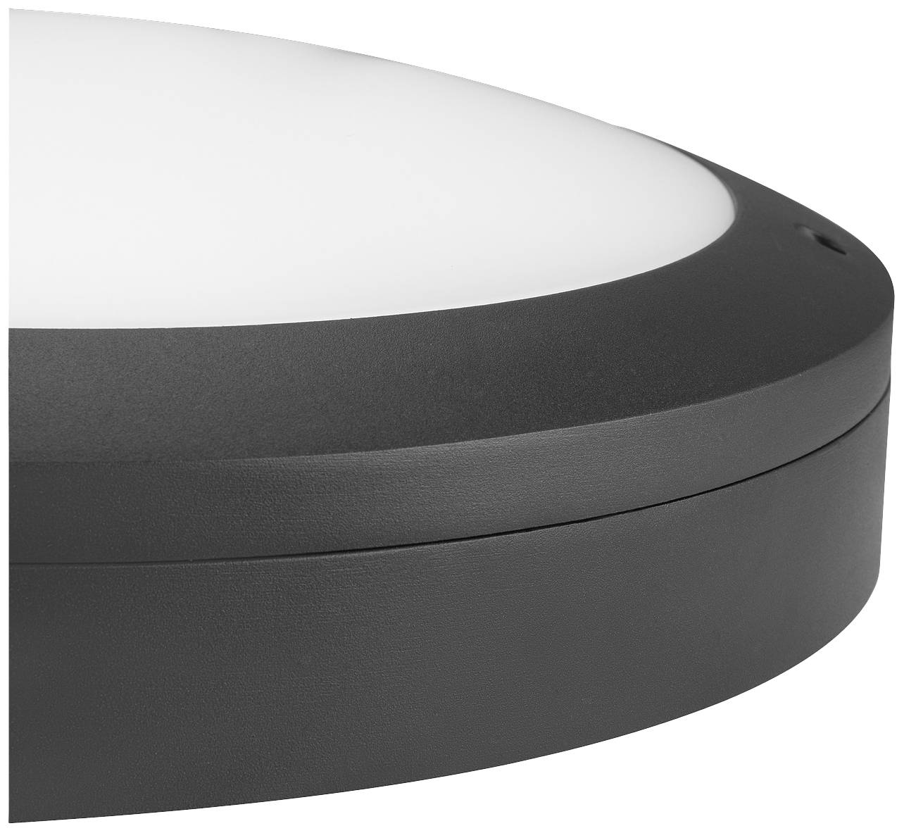 Round, black lamp with white, semi-circular illumination area, suitable for wall mounting. Simple, modern design.
