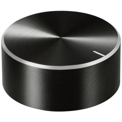 Black, round metal volume control with a textured surface and a small marker for orientation.