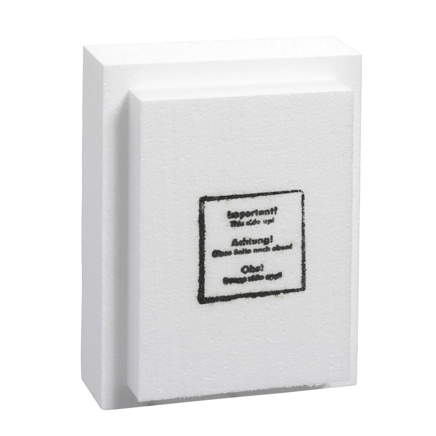 A white polystyrene block with text-based printing in the centre, containing safety instructions in multiple languages.
