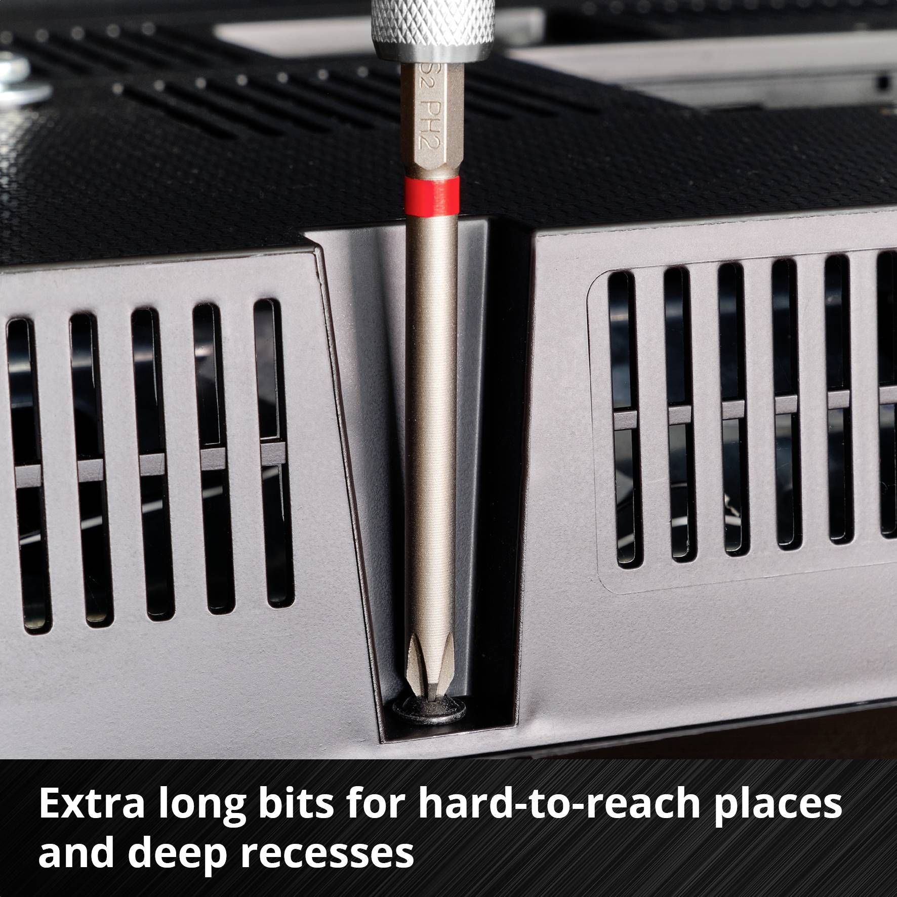 Long screwdriver in a ventilation grille. Text: 'Extra-long bits for hard-to-reach places and deep recesses'.