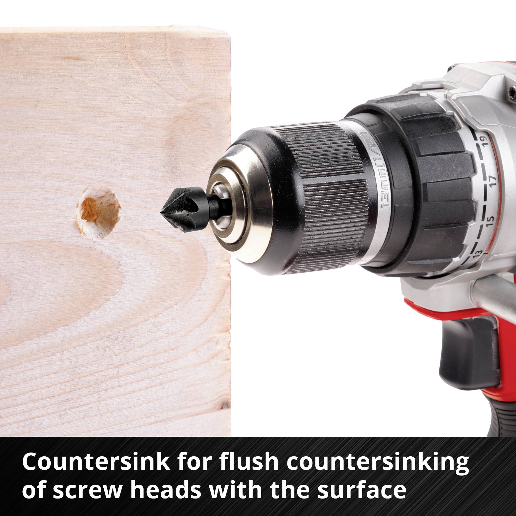 A drill with a countersink bit is drilling a hole in a piece of wood. An explanatory text band states: 'Lower countersink bit flush'