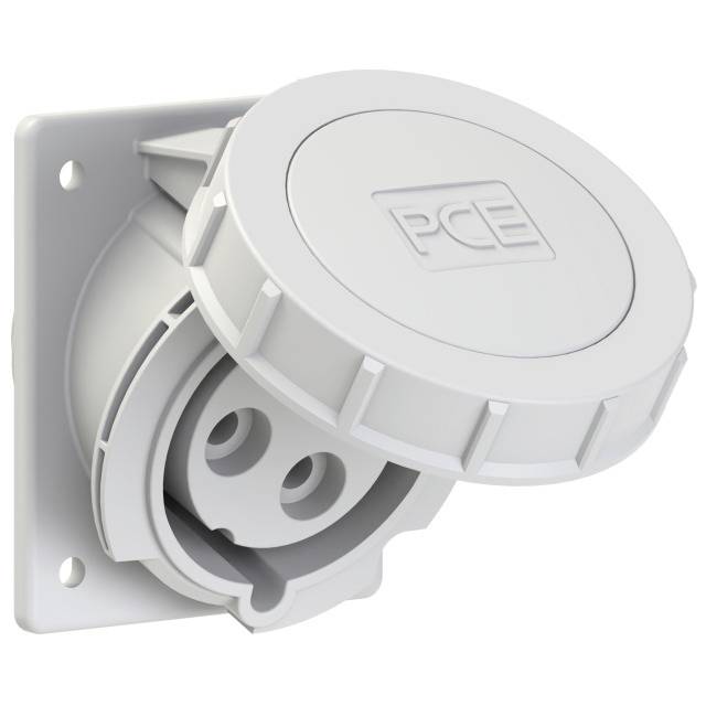A grey industrial coupling with a protective cover from the PCE brand, mounted on a wall. It serves as a secure electrical connection.