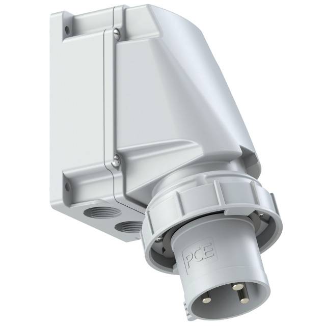 Grey-white industrial socket in an angled view. The connection area and mounting elements are visible.