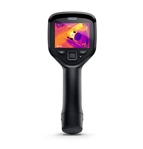 An infrared thermometer displays the thermal signature of an object on its screen. Temperature values are visible.