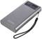 Portable power bank in a silver casing with LED display and lanyard. The brand name 'Voltcraft' engraved on the side.