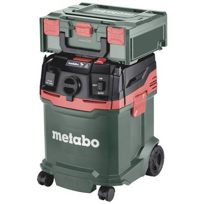 Green industrial vacuum cleaner on wheels with a red accent, top section features a small toolbox. 'Metabo' logo on the front.