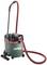 A green industrial vacuum cleaner with a red hose and black handle, standing on a light background. Brand name 'Metabo'.