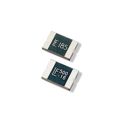 Two microchip components with labels 'E 185' and 'E 500 16', placed on a white surface. They are intended for electronic circuits.