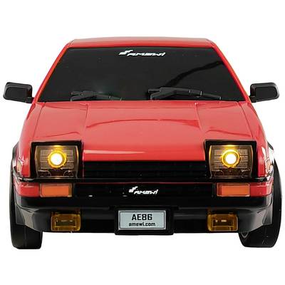 Red car from the front with illuminated headlights and a number plate reading 'AE86'.