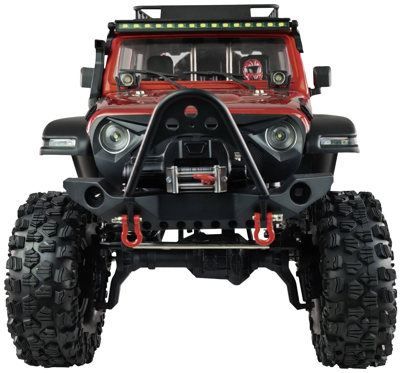 Toy model of an off-road Jeep with large, robust tyres and a red bodywork, photographed from the front.