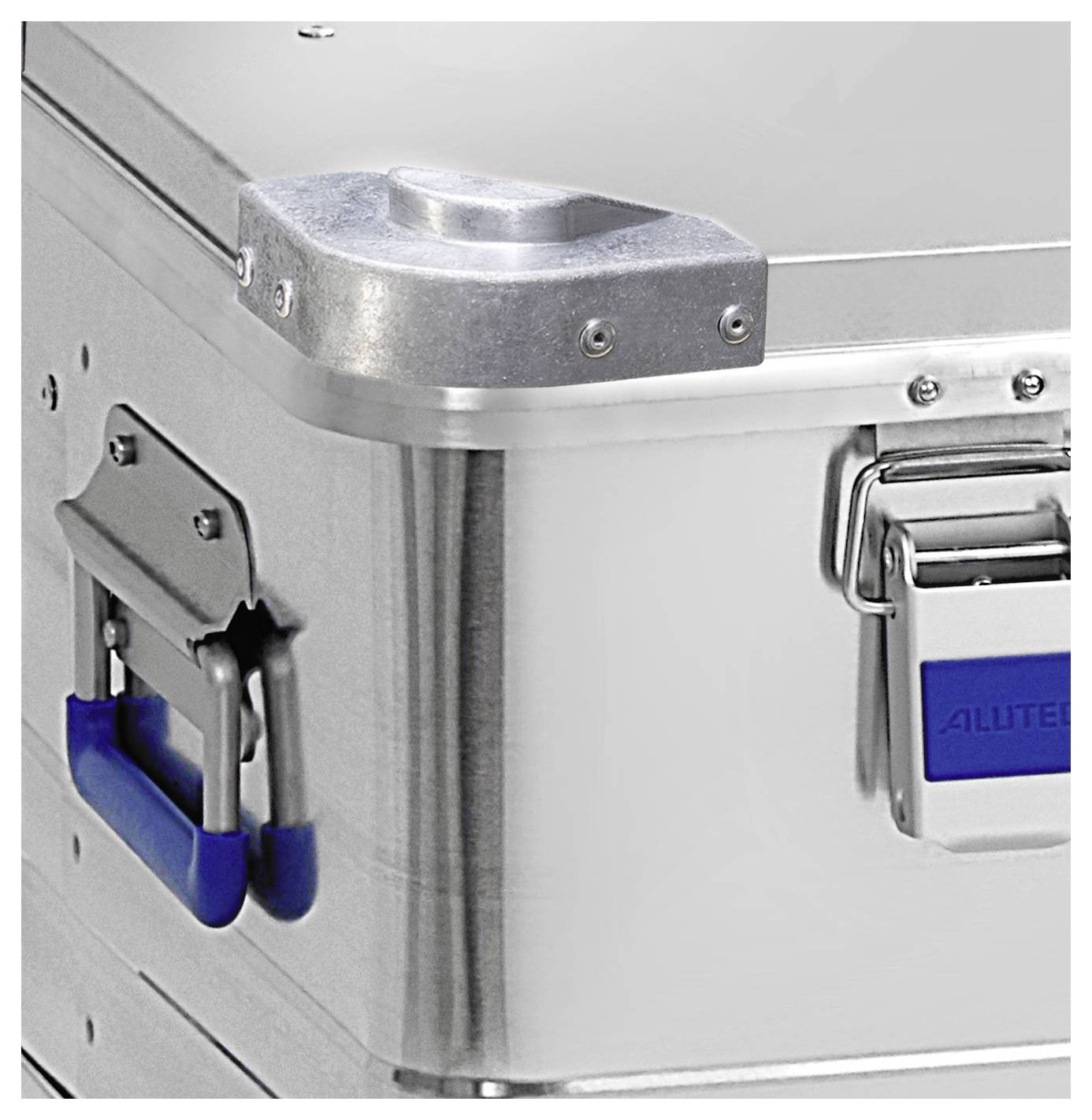 'A corner of a metal storage box with reinforced edges, featuring blue handles and metal latches, partially visible.'