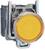 A yellow button with a metallic mounting, typical of industrial control devices.