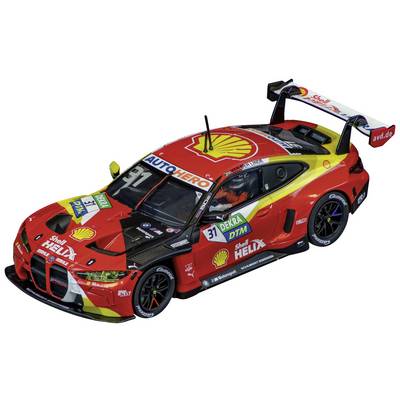A red and yellow racing car with the number 31, adorned with 'Shell Helix' logos and other sponsor decals, in a dynamic driving perspective.