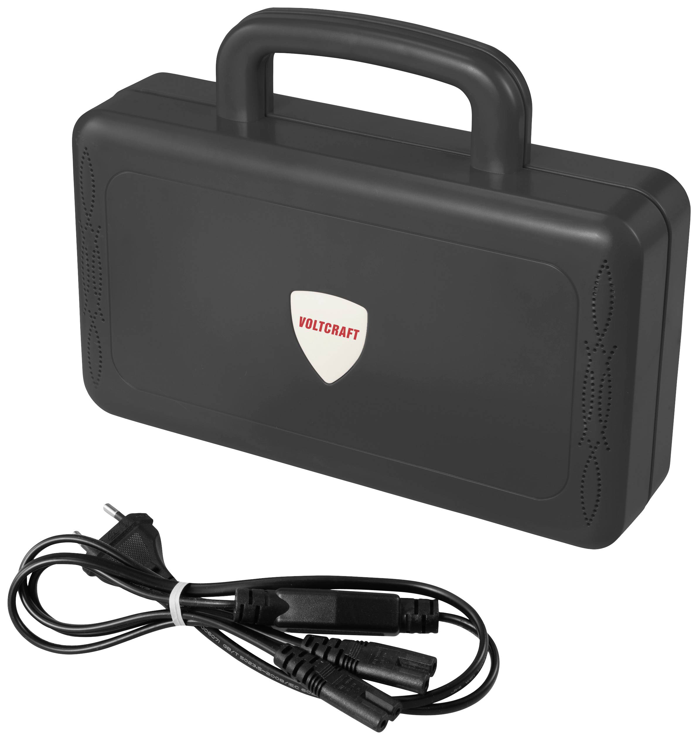 A black suitcase with a carry handle and 'Voltcraft' logo lies next to a mains cable.