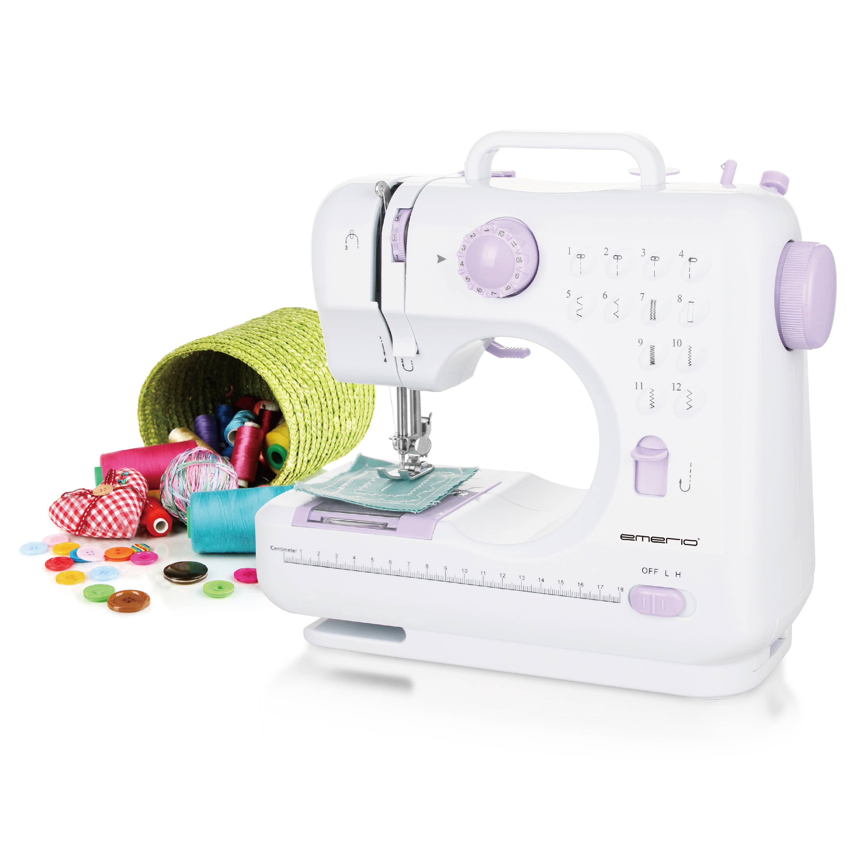 A white sewing machine with purple buttons, surrounded by colourful cotton reels, buttons and a green basket.
