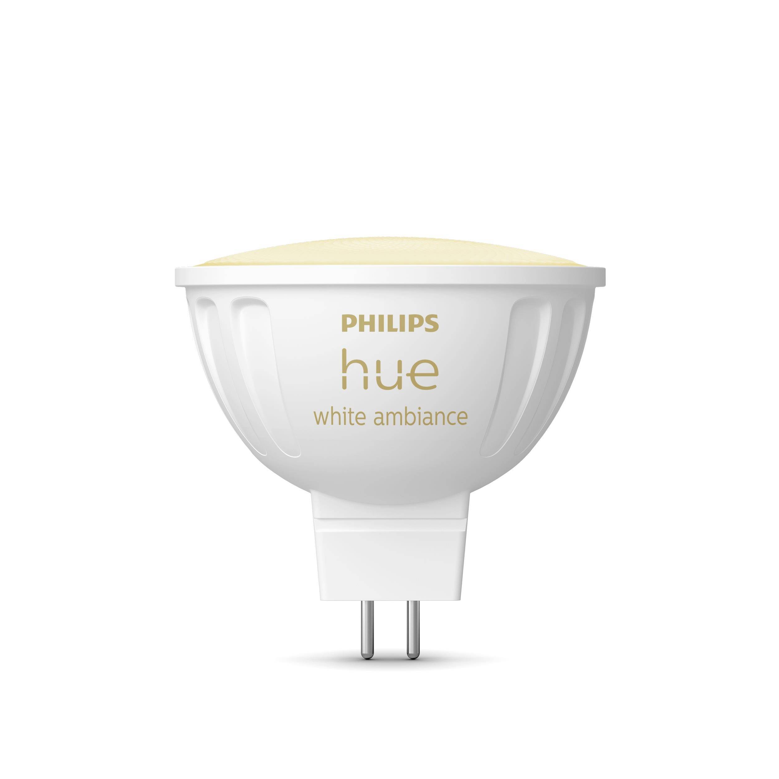A white Philips Hue lamp, model 'white ambiance', is shown head-on. It has a GU5.3 fitting and is suitable for standard light installations.