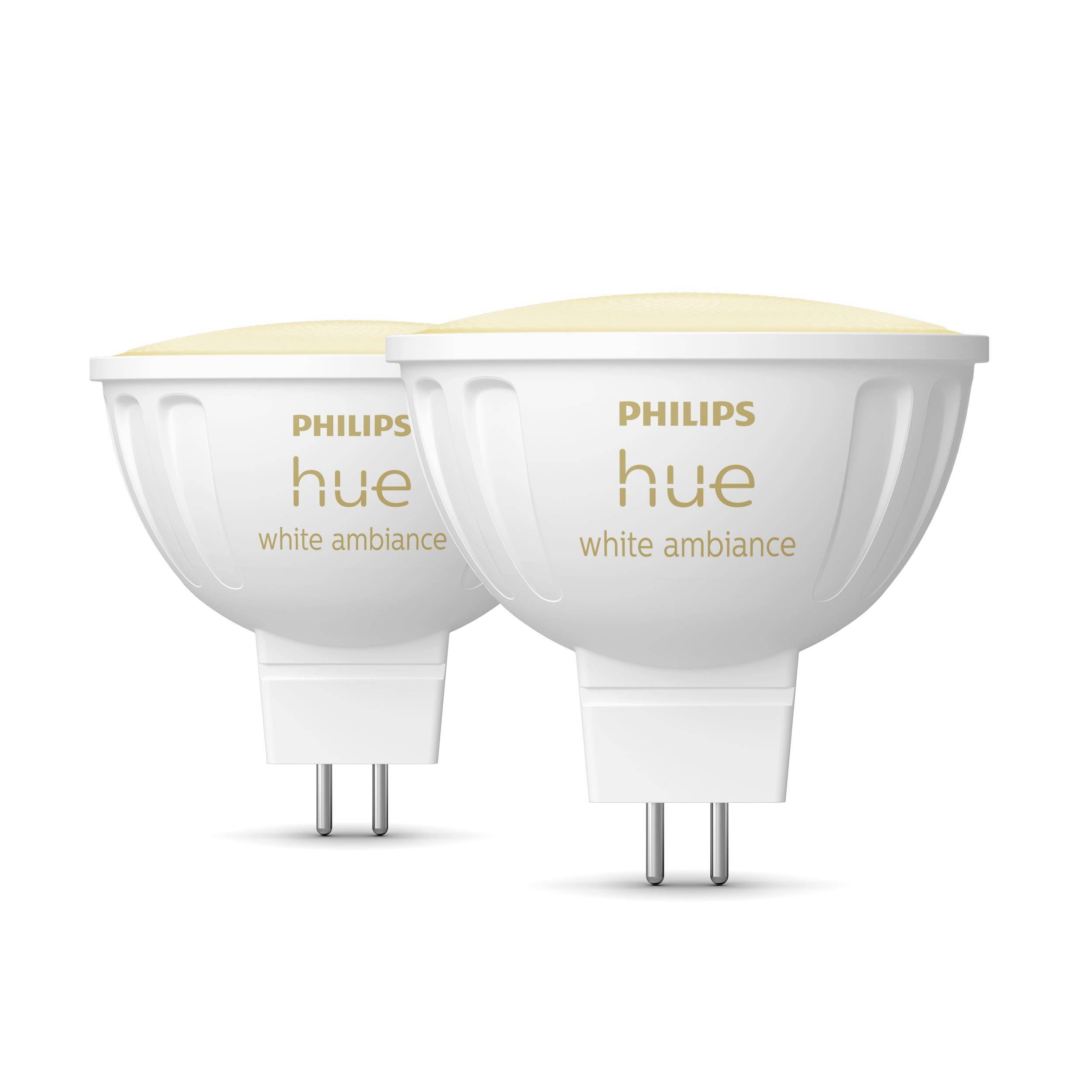 Two Philips Hue White Ambiance GU10 LED bulbs with warm white light, suitable for smart lighting and energy saving.