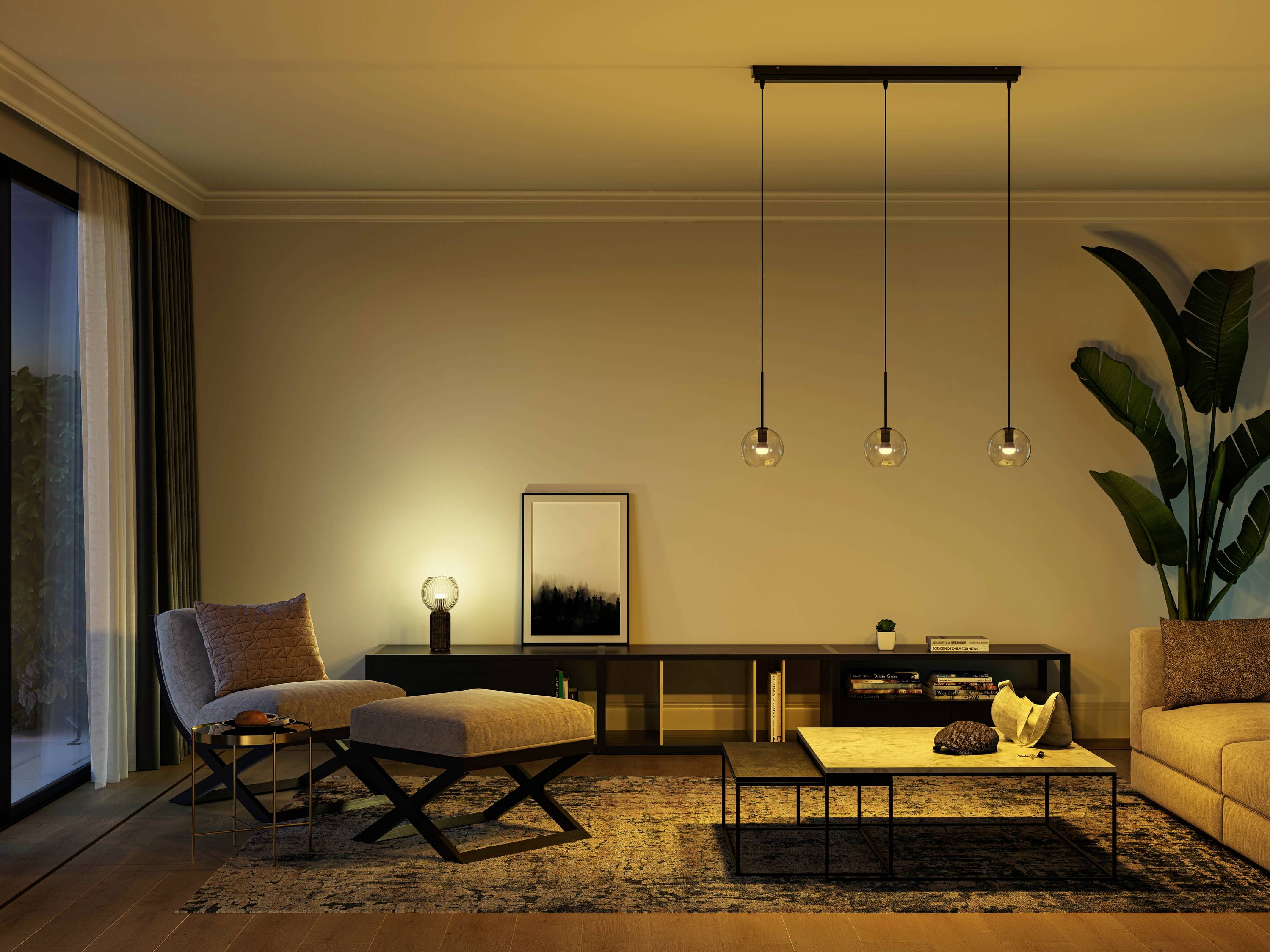 Cosy living room with warm lighting, modern furniture, a large plant arrangement and decorative elements on a rug.