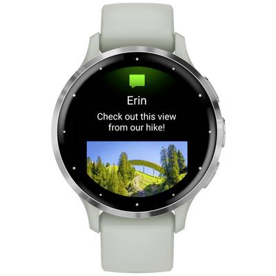 Smartwatch displays a message from 'Erin' with the text 'Check out this view from our hike!' and a photo of a bridge in a mountainous landscape in the background.